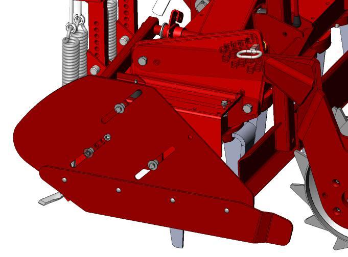 Osłony są podwieszone na uchylnych ramionach mocowanych do ramy za pomocą śrub. Osłona w czasie pracy kopiuje nierówności gleby przesuwając się na 3 prowadnicach.
