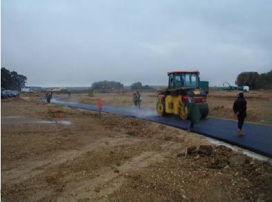 , Warm mix asphalt by adding a synthetic zeolite.