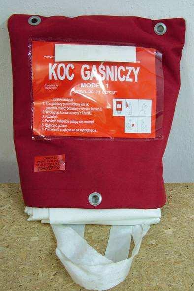 Koc gaśniczy Elastyczny płat materiału (zwykle z tkaniny szklanej) przeznaczony do gaszenia poŝarów w wyniku tłumienia (przez