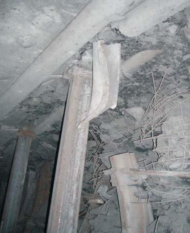 View of the deformed side section of steel arch in 5a roadway in 408/1 coal seam Rys. 26.