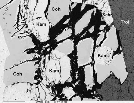 Quartz (Qtz) between chromite (Chr) and troilite (Troi), troilite replaced by iron hydroxides (Fe O,OH ), interior of a