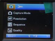 Menu ustawień kamerki FX201 w trybie aparat CaptureMode Określa sposób działania przycisku migawki, tzn.