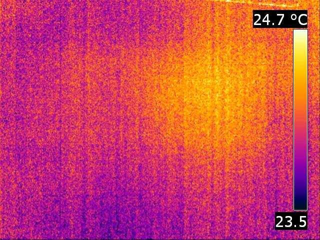 The hot spot indicates the landmine position, b) the thermogram acquired 10 minutes after the microwave heating.