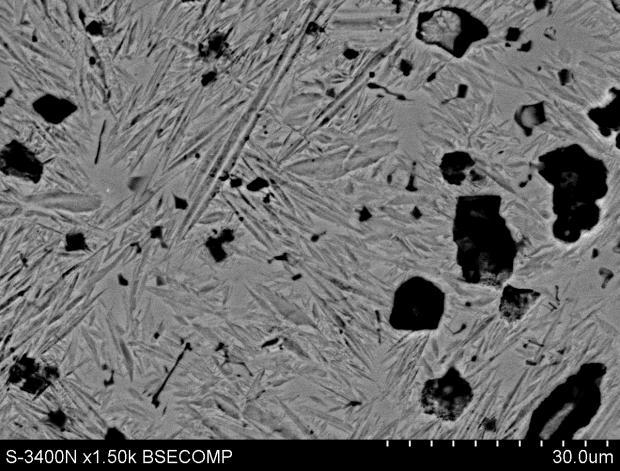 a) b) Rys. 5. Mikrostruktura warstwy napawanej z materiału zawierającego węglik TiC, a) SEM, b) EDX Fig. 5. Microstructure of welded layer with from material including carbide TiC, and) SEM, b) EDX Tab.