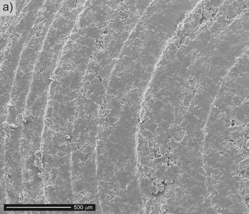 4-2013 T R I B O L O G I A 11 acid additives. The oxidation was carried out in 303 K for 180 A min/dm 2 electric charge density. Fig. 1. Surface morphology before tribological test: a) T5W material b) oxide layer Rys.