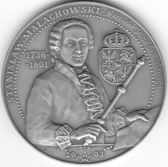 Na dole oddzielona poziomą kreską data: 2003 (rok emisji medalu) przedzielona emblematem Towarzystwa Wiedzy Obronnej(TWO).