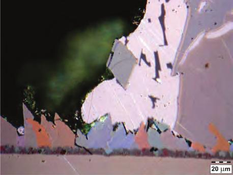 The images were made with the use of light microscopy involving polarised light to determine the presence of particular phases on the basis of their colours.