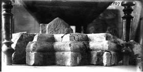 The preserved remains of "glauconitite" buildings: a) Gateway to Pallatium, b) Passage perimeter wall faced glauconitite (photo by S.