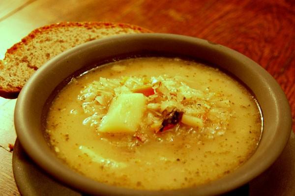 Sauerkraut soup Filip Synowiec, Vc 2 bouillon cubes 0,5 kg sauerkraut 2 carrots 1 parsley-root 1 little onion 1/2 little celery 200g smoked bacon 1/2 teaspoon cumin 1/2 teaspoon marjoram 4 potatoes 3