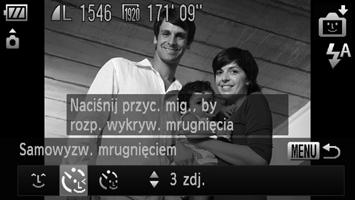 Korzystanie z funkcji samowyzwalacza mrugnięciem Nakieruj aparat na fotografowaną osobę i naciśnij do końca przycisk migawki.
