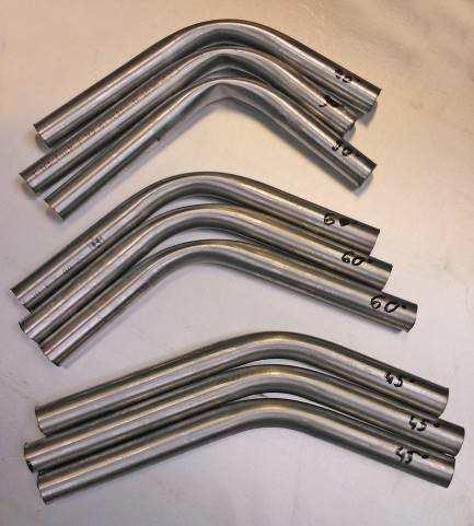 Samples were bent to angles 45, 60, and 90. a) b) Rys. 3.