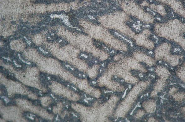 Cast steel after hardening and tempering in 650 o C (sorbite with after-austenite dendrite system and carbide eutectic on grains bounders) etching FeCl 3 magnification x200 Rys. 7.