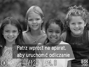 Migawka zostanie wyzwolona około dwie sekundy po wykryciu przez aparat nowej twarzy (str. 73). Tryb ten może się przydać, gdy fotograf chce się znaleźć na zdjęciu, np. grupowym.