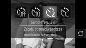 Korzystanie z samowyzwalacza Korzystanie z samowyzwalacza w celu przeciwdziałania poruszeniu zdjęcia Aparat zarejestruje zdjęcie mniej więcej 2 sekundy po naciśnięciu przycisku migawki, aby zapobiec