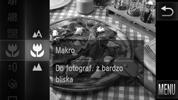 Zdjęcia z małej odległości (Makro) Obiekty można fotografować z niewielkiej, a nawet bardzo małej odległości. Zakres ostrości wynosi od około 3 do 50 cm od obiektywu przy maksymalnym oddaleniu (j).