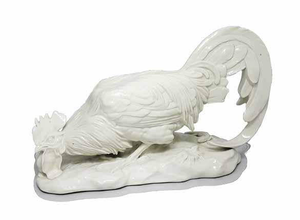 18 Figura koguta 1 poł. XX w. porcelana biała, szkliwiona; wys. 26,5 cm, dł.
