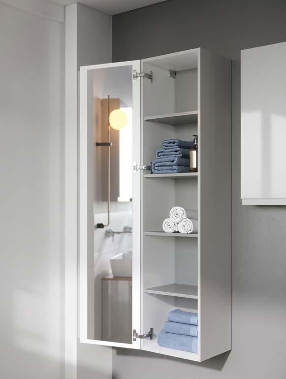 MEBLE I UMYWALKI MODUO MODUO FURNITURE AND WASHBASINS PRAKTYCZNY SŁUPEK PRACTICAL PILLAR Zawiasy zastosowane w drzwiach słupka mają szeroki