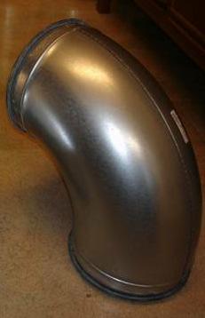 Drawpiece elbow after welding, where: a) drawing with dimensions and spatial visualization, b) photograph of the ready product made available by the client, wall thickness 0.6 mm 2.5.