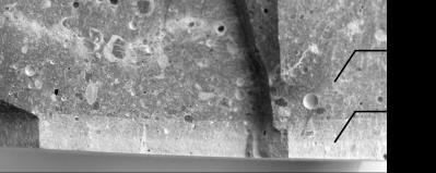 Rys. 2. Przełam próbki: 1 - zdegradowana strefa brzegowa, 2 nieuszkodzony zaczyn Fig. 2. Hydrated cement paste fracture: 1 - degraded edge zone, 2 untreated zone Na rys.