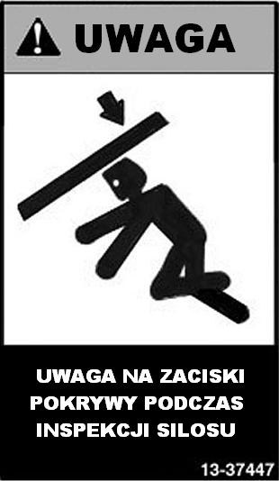 umieszczony przy górnej pokrywie Znak