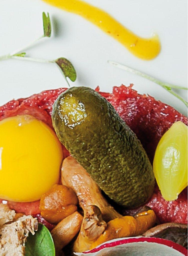 tartare with pickles and a slice of toast.