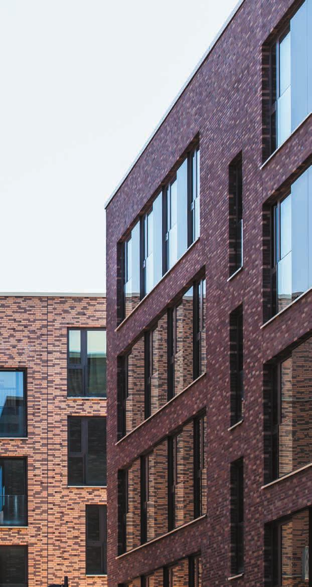 Enplusarchitecten, Gent, Belgia Po prawej: Domy