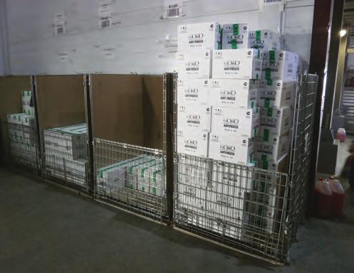 containers on running platforms in a factory producing car