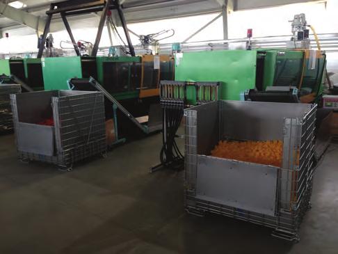 samochodowe ENG: Containers with skids on high storage racks in a company producing car