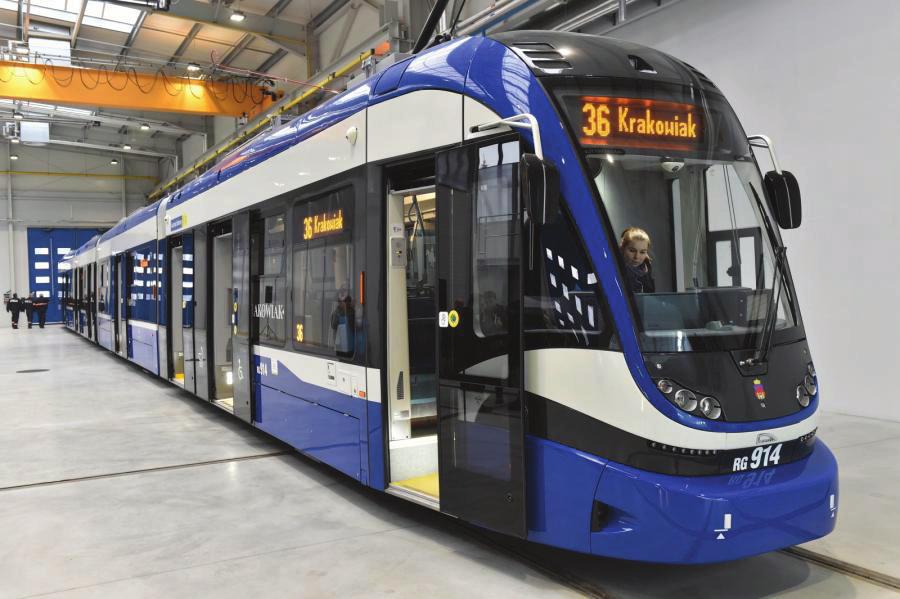 128 W godzinach szczytowych na linii nr Bombardier NGT8 i Bombardier NGT6. a. b. Rys. 3. Nowy tramwaj PESA 2014N ( Krakowiak ) wykonany specjalnie dla Krakowa: a. Krakowiak w, b.
