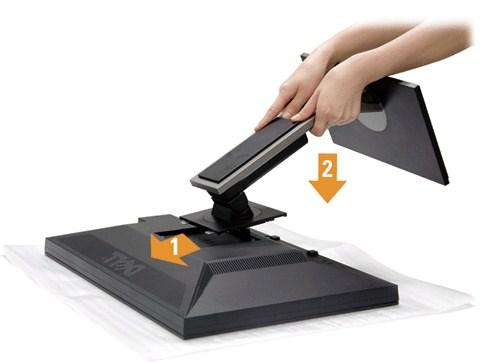 Powrót do spisu treści Ustawienia monitora Przewodnik użytkownika monitora płaskiego Dell P2210 Podłączanie podstawy Podłączanie monitora Organizacja przebiegu kabli Podłączanie panelu dźwiękowego