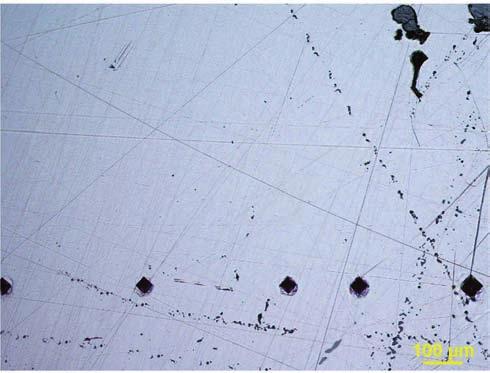 The microscopic image of non-metallic inclusions in the cutting-edge (a) and the back (b) of the knife, described as E from the Ołbin (the Benedictine monastery) before etching (500x magnification)