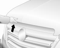 Wyjąć podporę z uchwytu i umieścić w zaczepie znajdującym się po prawej stronie pokrywy silnika.