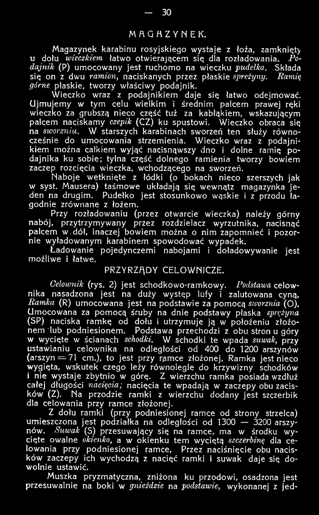 Wieczko wraz z podajnikiem można całkiem wyjąć nacisnąwszy dno i dolne ramię podajnika ku sobie; tylna część dolnego ramienia tworzy bowiem zaczep rozcięcia wieczka, wchodzącego na sworzeń.