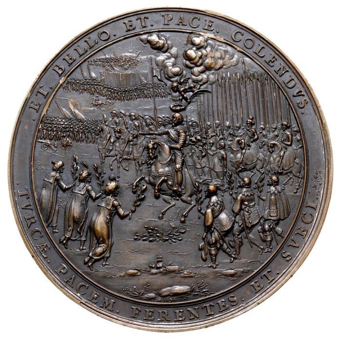 Awers medalu ukazuje scenę składania chorągwi oraz klęczących dowódców pokonanych wojsk. Obok króla odzianego prawdopodobnie w kirys - żołnierz z rapierem w dłoni. W tle widać wojska z kopiami.