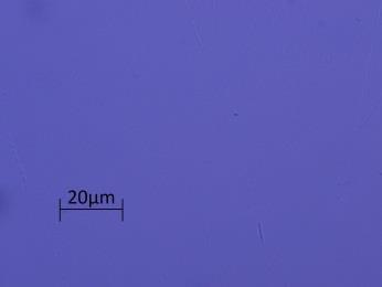 0, 680 C) i na koniec odprężono z prędkością studzenia 0,5 C/min. Po ostygnięciu wycięto płytkę z przekroju próbki i obserwowano pod mikroskopem polaryzacyjnym.
