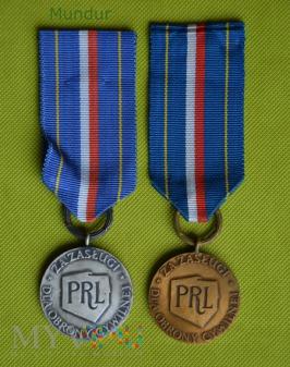 Odznaka za Zasługi dla OC - srebrna