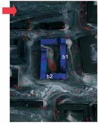 Prze pływ po wie trza przez kwar tał 3 w wa rian cie 2 przy wie trze od za cho du (oznaczenia b1 i b2 określają położenie wprowadzonych bram), fotografia z badań tunelowych metodą olejową, fot. A.