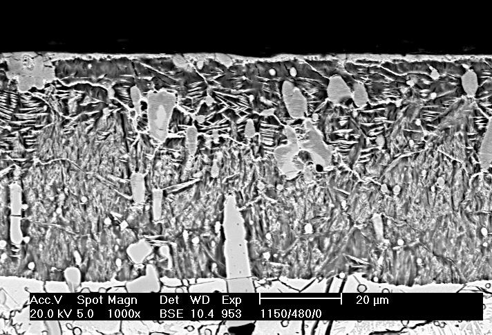 Transition between the deformed and undeformed part of an NC11LV steel sample hardened from 115 o C and ion nitrided at 48 o C; scanning microscope, magnification 2 x a) b) Rys. 14.