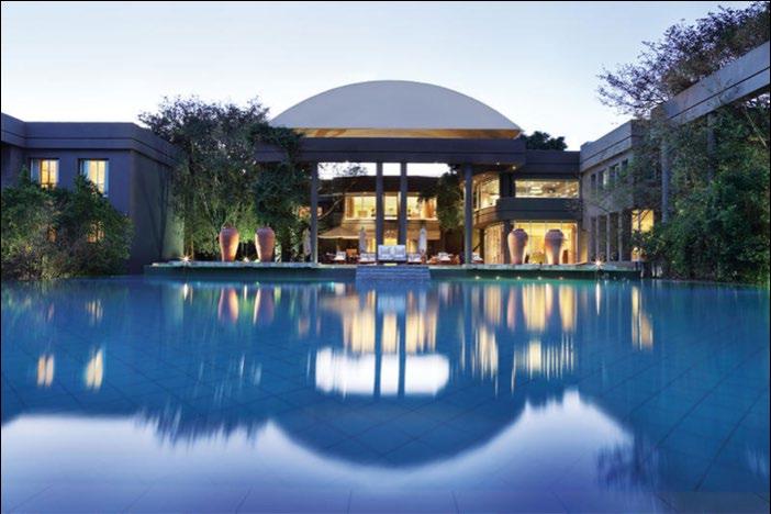 DAYS 1-2 Saxon Hotel, Villa & Spa, Johannesburg, South Africa 1 night at the Saxon Hotel, Villa & Spa in a villa luxury suite on a bed and