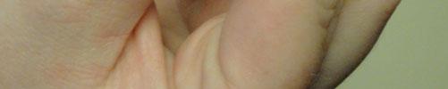 between their thumb and forefinger.