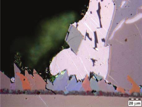 The images were made with the use of light microscopy involving polarised light to determine the presence of particular phases on the basis of their colours.
