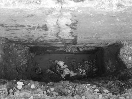 In the picture above, we see one of the two large cracks found in the foundation of our
