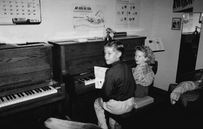 Our mom is a piano teacher so there was a lot of music in our house. Hey Lyanne, come help me with this. I d scoot onto the piano bench beside Patrick. You do this part.