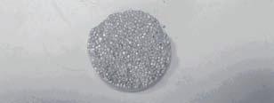 Wypraski powstałe ze sprasowania mieszaniny proszku Al z gąbką tytanową (95% wag./5% wag.) Fig. 35. Compacts of powdered Al/titanium sponge composition (95 wt. %/5 wt. %) Rys. 36.