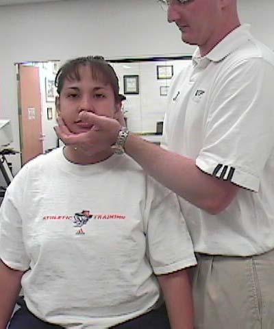 Distraction Test Examiner begins by placing the open palm of one hand under the pt s chin with the other hand on the occipital bone at the base of the