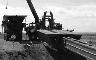 View of the segments of the bridge and of the launching beam in the transport position and assembly of the MMK span segments on the launching beam [21] The supporting structure of the spans consists