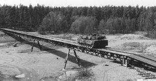102 Zbigniew KAMYK In September 1996, Kockums AB, as one of the two competing main contractors, received an order from the US Army Tank Automotive and Armaments Command (TACOM) to develop a heavy