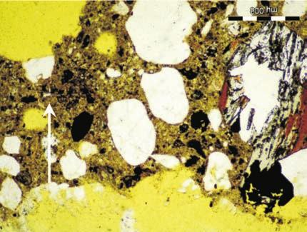 Microstructure of concrete made with 30% of unprocessed calcareous fly ash after 56 days in 1% of CO 2 : a) thin section, polarized light, b) thin section, crossed polarized light Rys. 8.