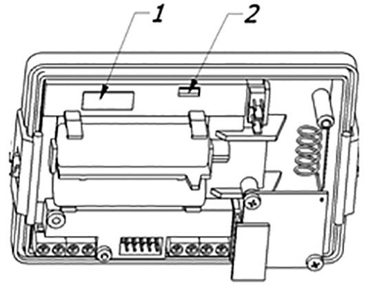 Plombowanie przelicznika 1: Samoprzylepna plomba producenta na otworze dostępu do przełącznika aktywacji kalibracji plomba weryfikacji metrologicznej.