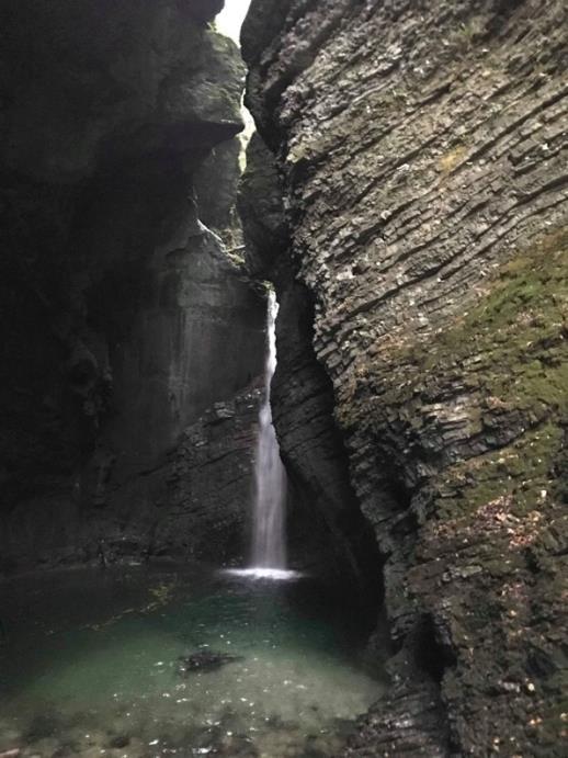 Then we entered a cave with the waterfall and it was very pretty. We took many pictures and admired the waterfall. We had an amazing time discovering Slovenia s natural beauty.